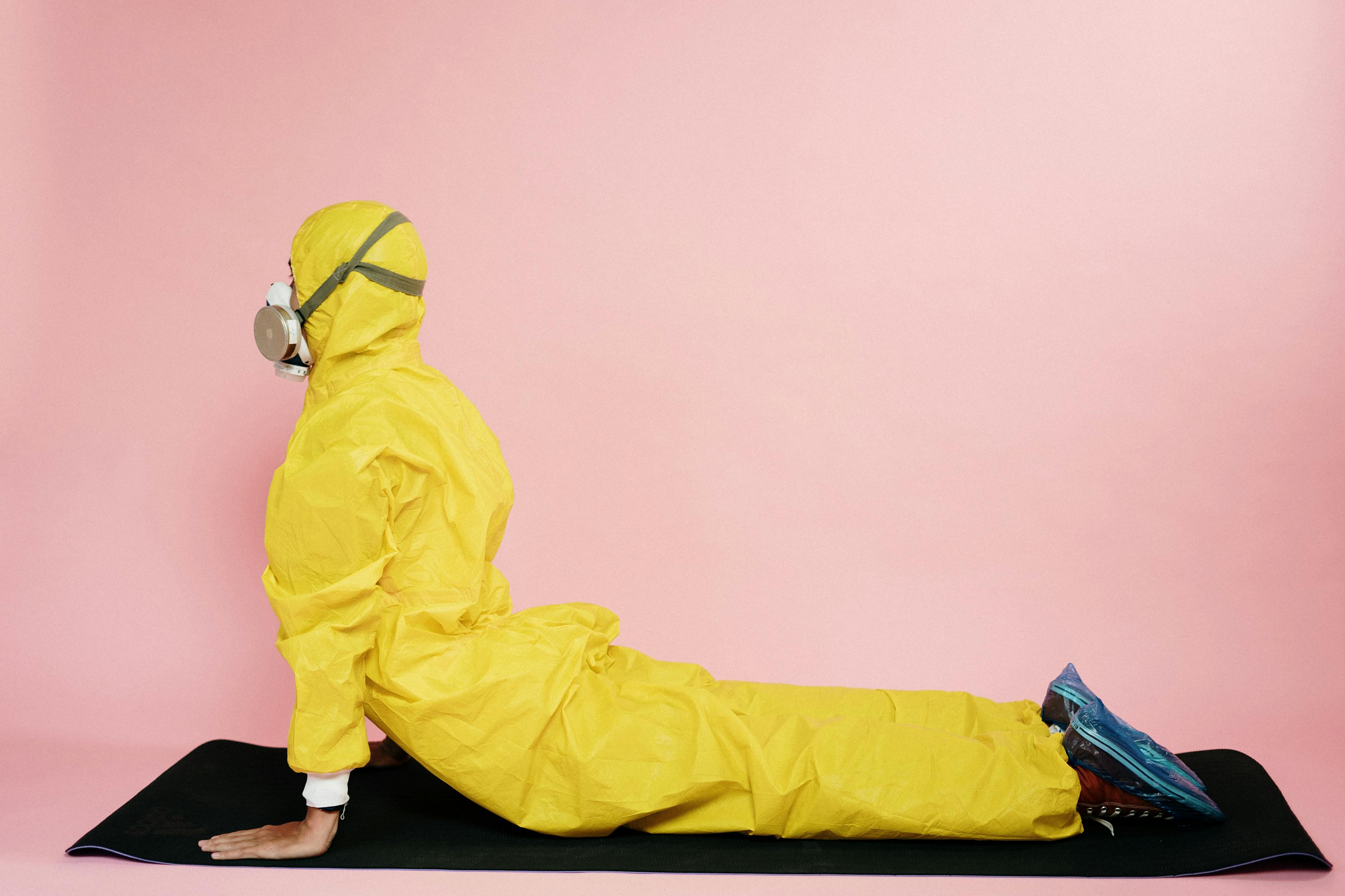 man-in-yellow-protective-suit-stretching-3951375