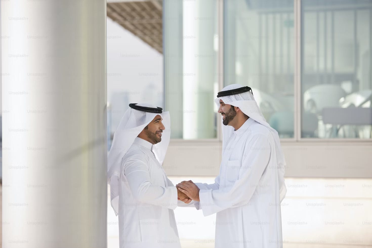 Two Arab guys shaking hands